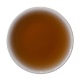 Steeped cup Dragon's Shadow Ripe Shu Puer tea cake